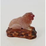 A Chinese agate hand carved figure of a lion.
