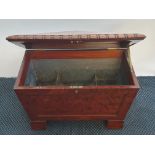 A 19th century mahogany sarcophagus shaped led lined wine cooler with hooped handles to side.