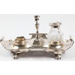 A Victorian silver desk stand with ink well and candlestick holder, desk stand of scroll edge design