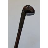 A 19th century Zulu Knobkerrie war club with woven metal grips.