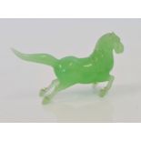 A Chinese jade / jadeite hardstone carved figure of a horse.