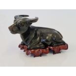 A Chinese green hardstone carved figure water buffalo.