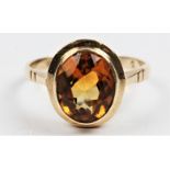 A hallmarked 9ct yellow gold citrine single stone ring, set with an oval cut citrine, ring size L