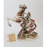 A CapoDimonte Tiziano Galli Figure far west cherub children on horse.