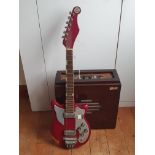 A Tremo twenty vintage Cherry Red Electric Guitar together with Bird Amplifier.