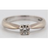 A hallmarked 18ct white gold diamond solitaire ring, set with a round brilliant cut diamond,