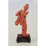 A Chinese red coral hand carved figure of a maiden or Goddess signed.