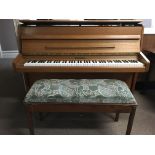 A Knight teak cased upright piano with duet stool, approx length 137cm.