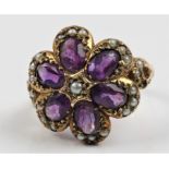 A hallmarked 9ct yellow gold amethyst and seed pearl flower design ring, ring size K.