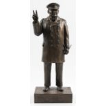 A bronze finished statue showing Sir Winston Churchill with his right arm raised in the ‘V’ sign and