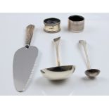 A collection of hallmarked silver, to include a Georgian ladle, a napkin ring and a silver handled