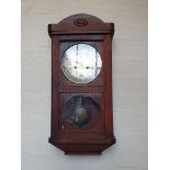 An Oak Case Wall Clock.