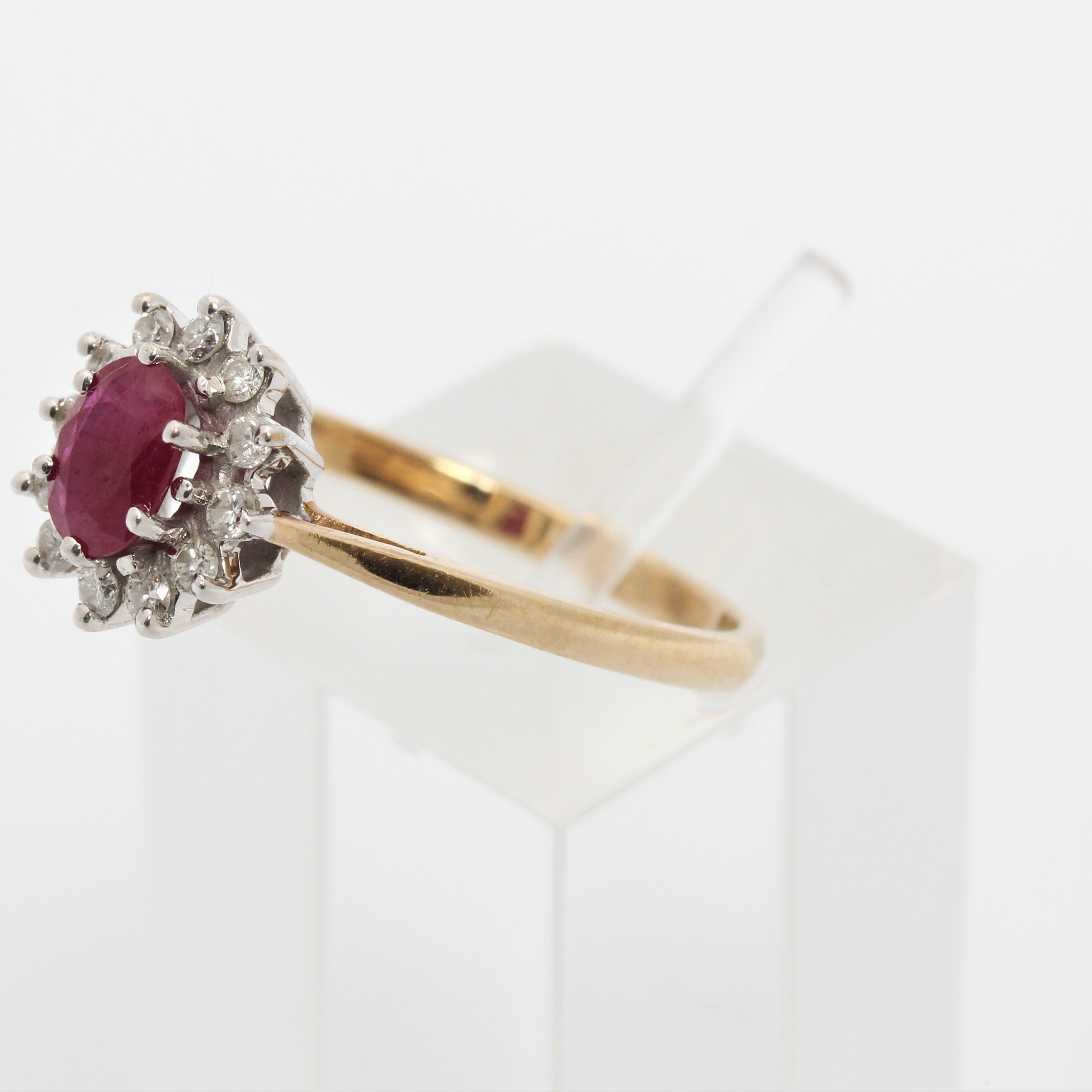 A hallmarked 9ct yellow gold ruby and diamond cluster ring, ring size Q1/2, approx. weight 1.9g. - Image 7 of 7