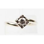 A hallmarked 9ct white gold diamond solitaire ring, illusion set with a round brilliant cut