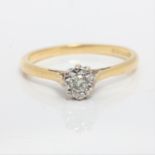 A hallmarked 18ct yellow gold diamond solitaire ring, illusion set with a round brilliant cut