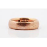 A hallmarked 9ct rose gold plain wedding band, ring size U, approx. weight 10.5g.