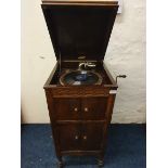 A Stonia wind-up Gramophone in oak floor standing case.