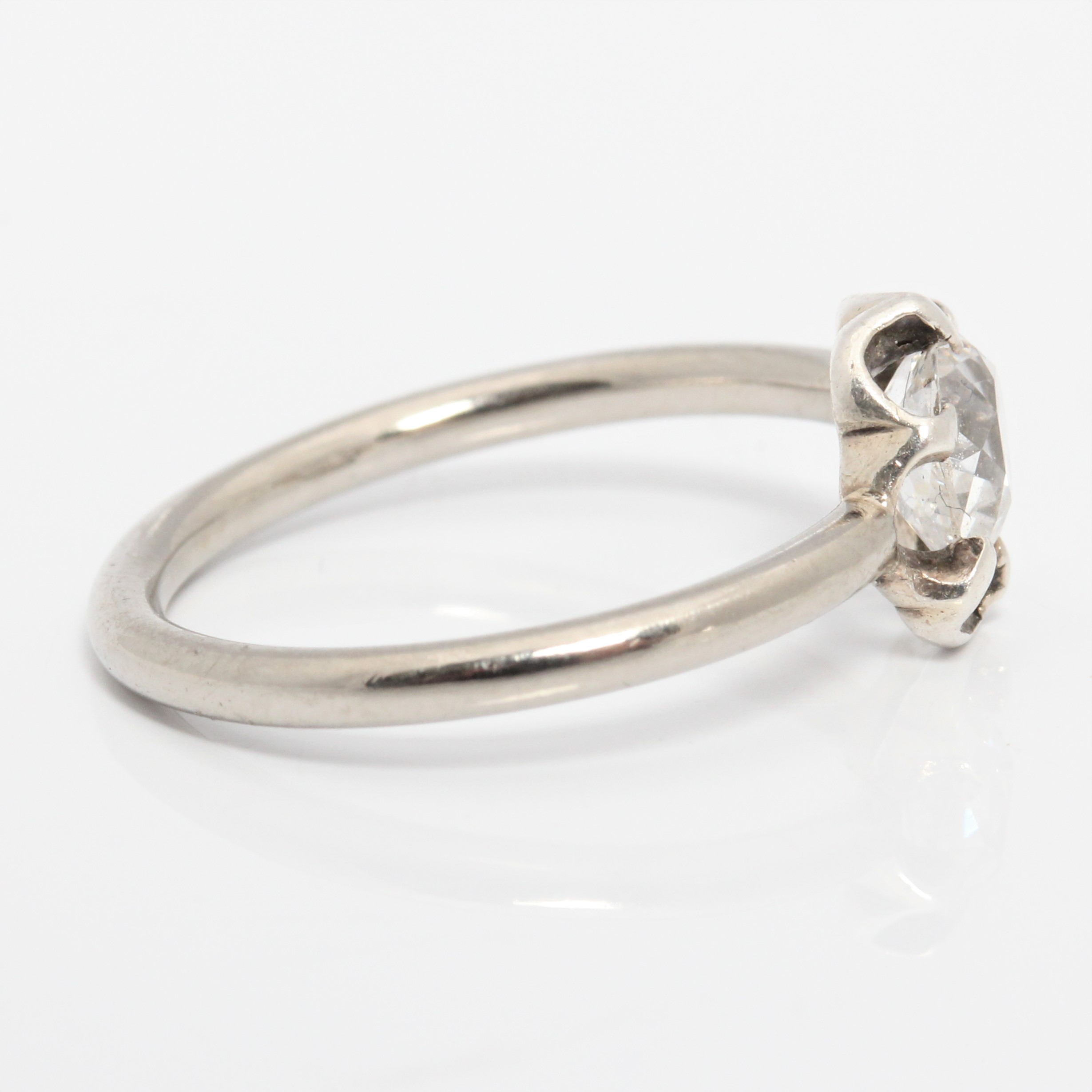 A diamond solitaire ring, set with an old pear cut shaped diamond, measuring approx. 0.45ct, in an - Image 2 of 4