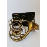 An Excelsior Sonorous Hawkes & Son London French horn with four additional pipes, together with a