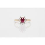 A hallmarked 9ct yellow gold ruby and diamond cluster ring, ring size Q1/2, approx. weight 1.9g.