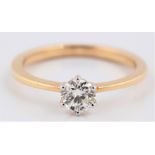 A hallmarked 18ct yellow gold diamond solitaire ring, set with a round brilliant cut diamond,