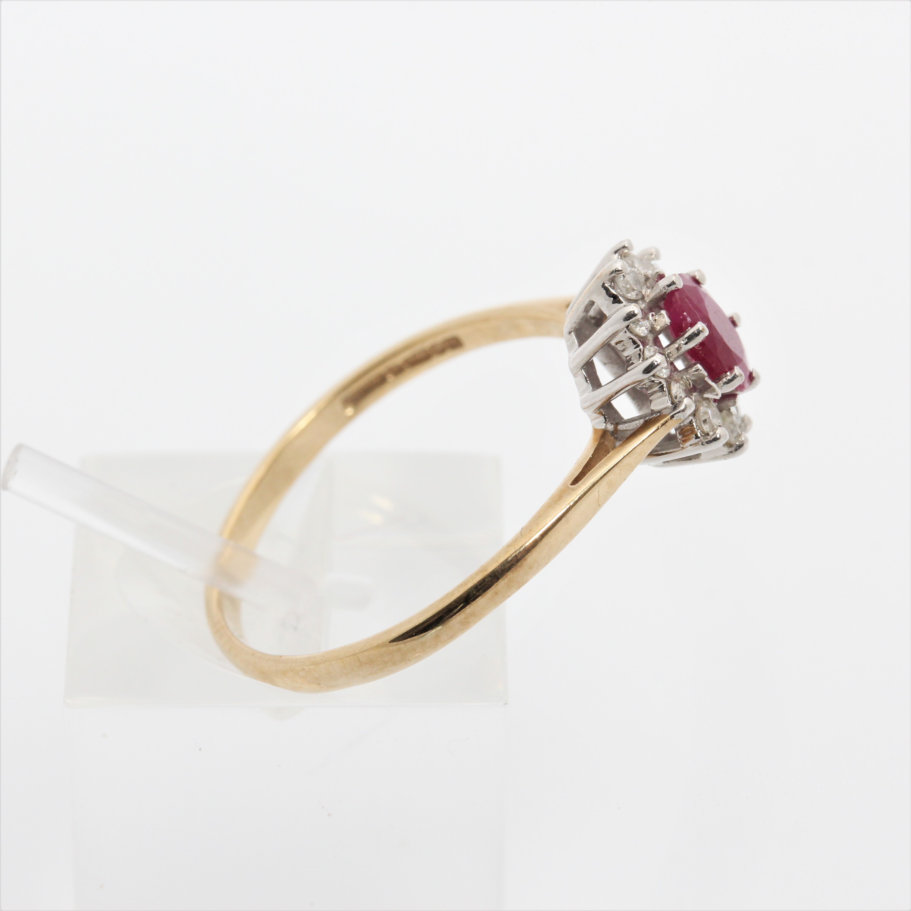 A hallmarked 9ct yellow gold ruby and diamond cluster ring, ring size Q1/2, approx. weight 1.9g. - Image 2 of 7