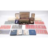 A collection of boxed coin sets including 1977 Silver Jubilee (silver & gold plated) ; Britain's