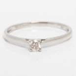 A hallmarked 9ct white gold diamond solitaire ring, set with a round brilliant cut diamond measuring