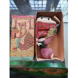 A Japanese fur and fabric covered clockwork Cragstan toy bear, “The Busy Housekeeper”