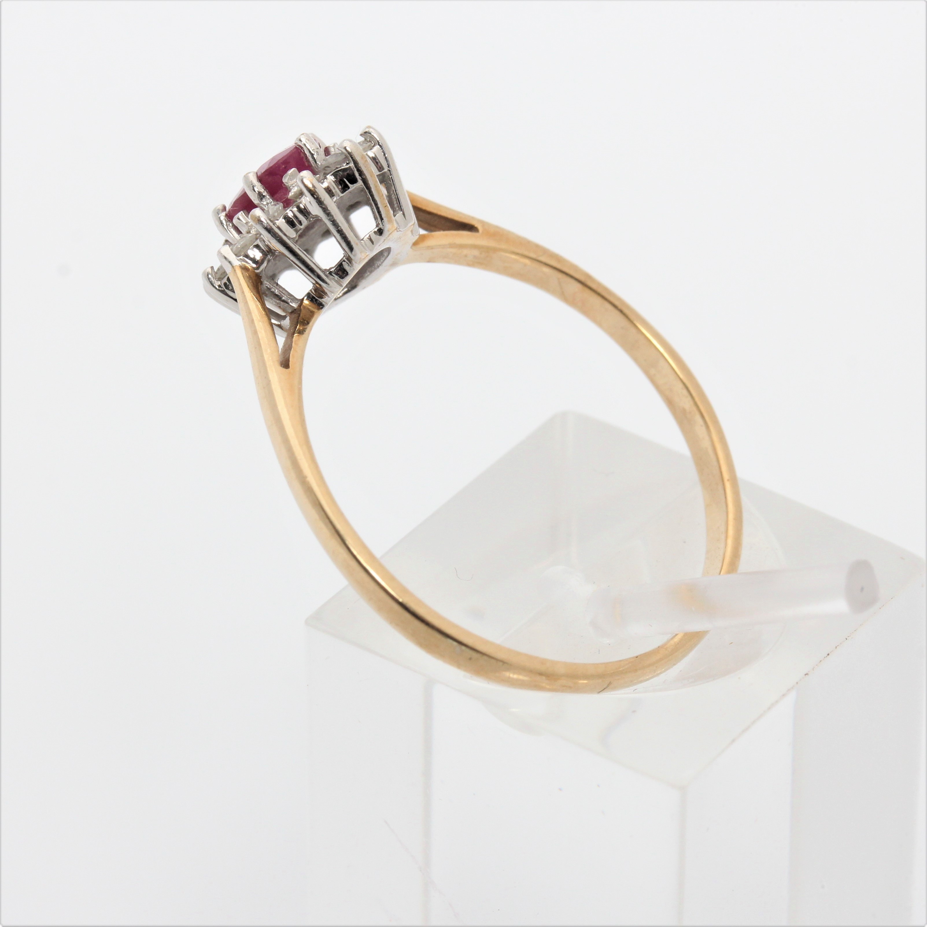 A hallmarked 9ct yellow gold ruby and diamond cluster ring, ring size Q1/2, approx. weight 1.9g. - Image 5 of 7