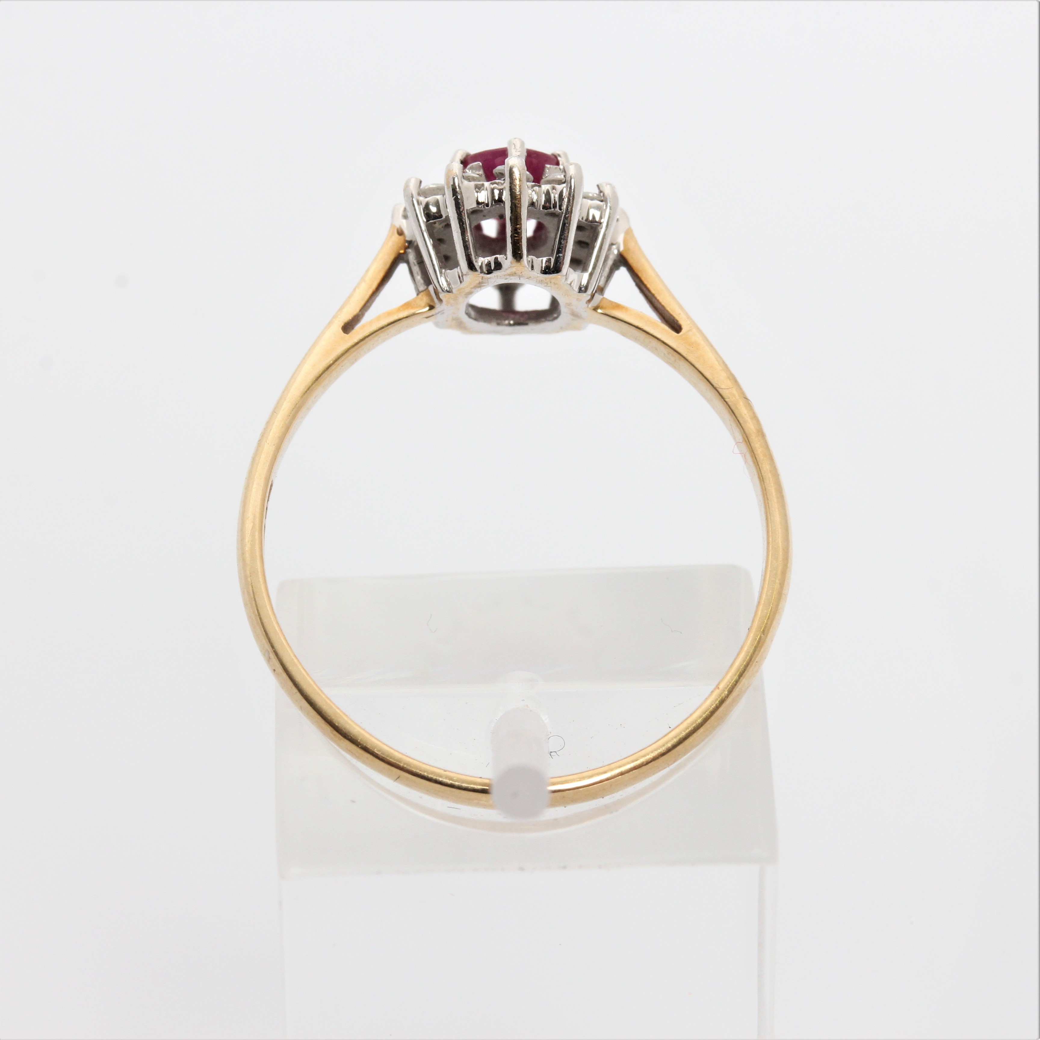 A hallmarked 9ct yellow gold ruby and diamond cluster ring, ring size Q1/2, approx. weight 1.9g. - Image 4 of 7