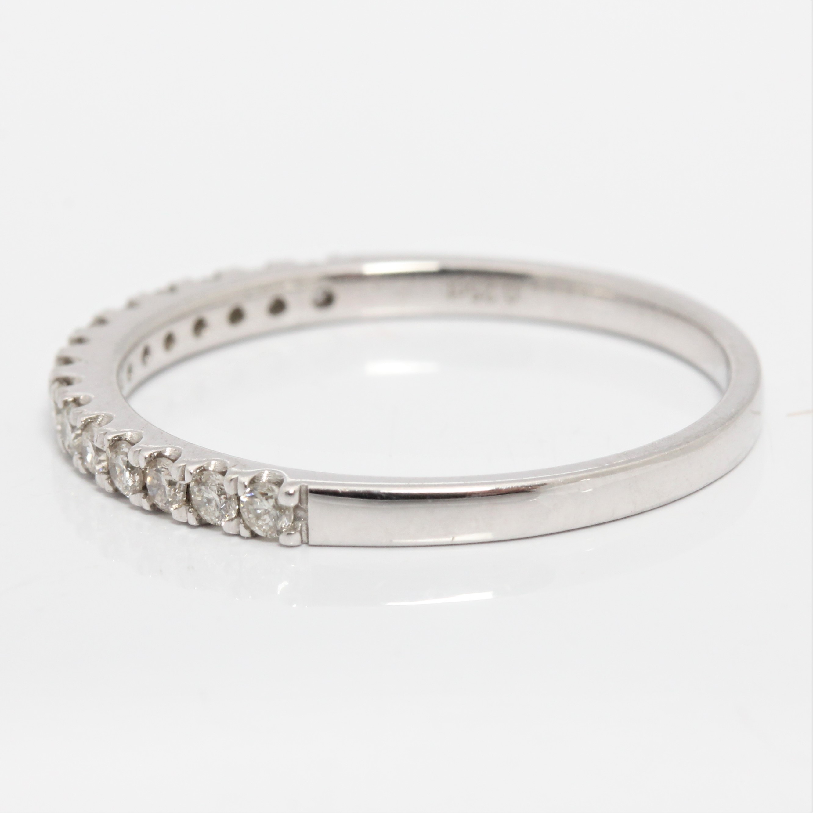 A hallmarked 9ct white gold diamond half eternity ring, set with fifteen round brilliant cut - Image 4 of 4