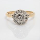 A diamond cluster ring, indistinctly stamped, ring size M