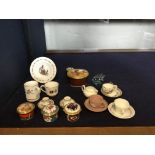 A collection of miniature cabinet items, to include cups, saucers and small pillboxes