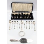 A boxed set of twelve hallmarked silver apostle spoons and a pair of sugar tongs, together with a