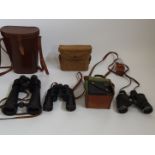 Three binoculars to include Bausch and Lomb with canvas military case, Optolyth and Barr and Stroud