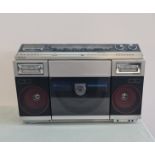 A Sharp VZ-2000 ghetto blaster with both sides play disc system.