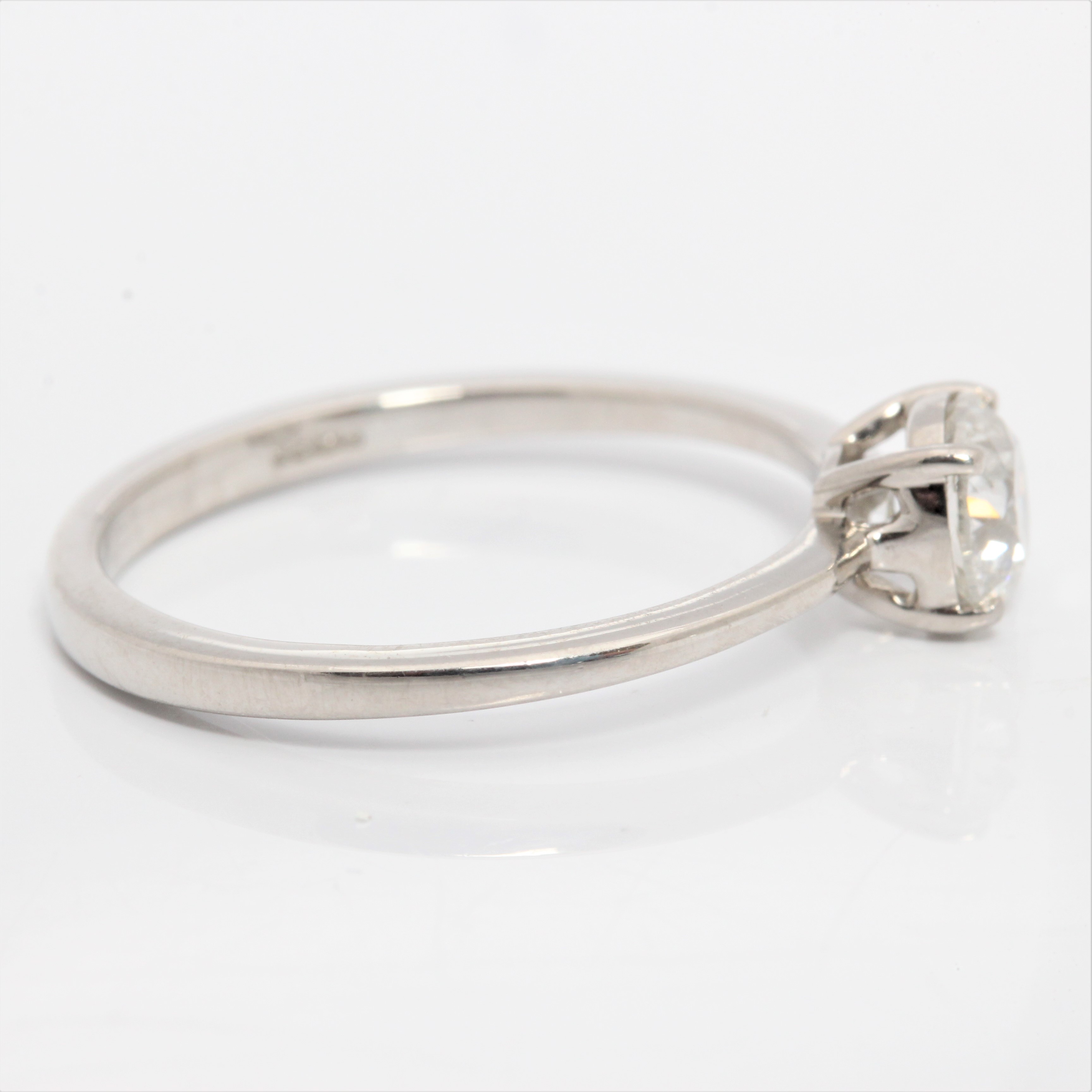 A hallmarked platinum diamond solitaire ring, set with a round brilliant cut diamond measuring - Image 2 of 4