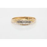 A five stone diamond ring, stamped 18, ring size P.