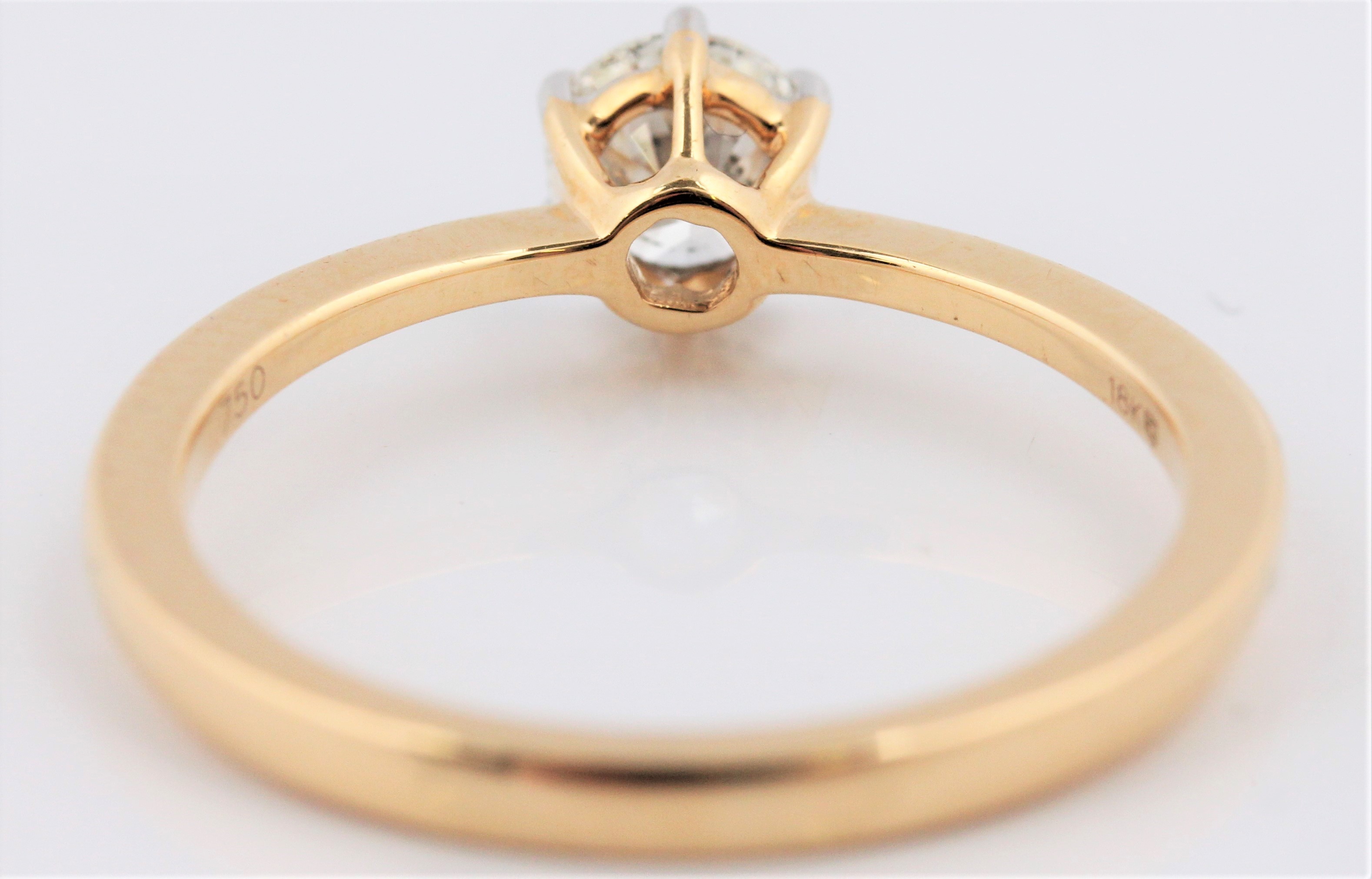 A hallmarked 18ct yellow gold diamond solitaire ring, set with a round brilliant cut diamond, - Image 3 of 3