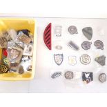 A collection of mixed badges including military. No condition report on this lot, Please View.