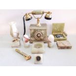 A collection of Onyx pieces to include a phone, two eggs in egg cups, two boxes, a clock, a cigar
