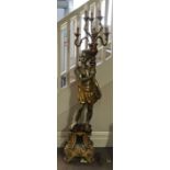 A mid-twentieth century painted Blackamoor, floor standing, six branch candelabra. Approx. height