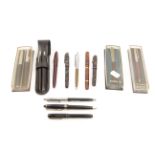 A collection of various pens and propelling pencils, to include examples by Mabie, Todd & Co.,