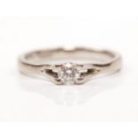 A hallmarked 18ct white gold diamond solitaire ring, set with a round brilliant cut diamond