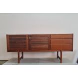 Macintosh, three-drawer teak sideboard.