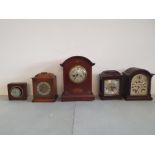 Five various mantle clocks.