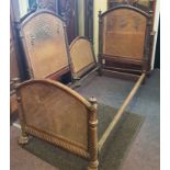 A pair of French mahogany single beds twisting Column going down to claw feet with woven headboard.