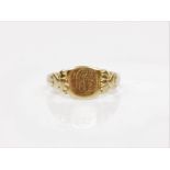 A hallmarked 18ct yellow gold signet ring, with engraved monogram to head, ring size O