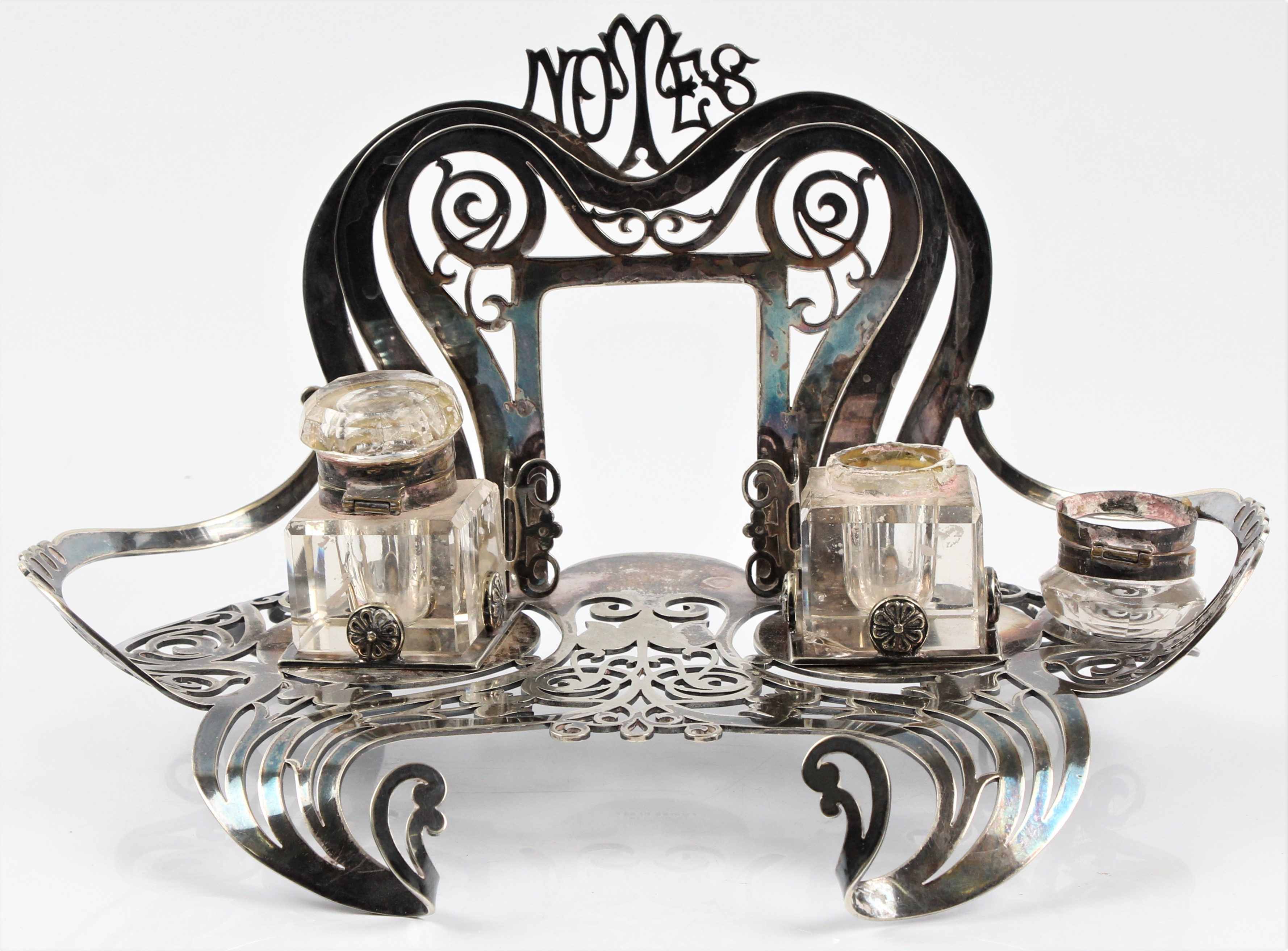 An Empire Plate Art Noveau desk stand housing two inkwells, (A/F).